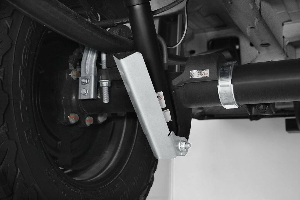 Close-up of a vehicle's shock absorber and wheel assembly